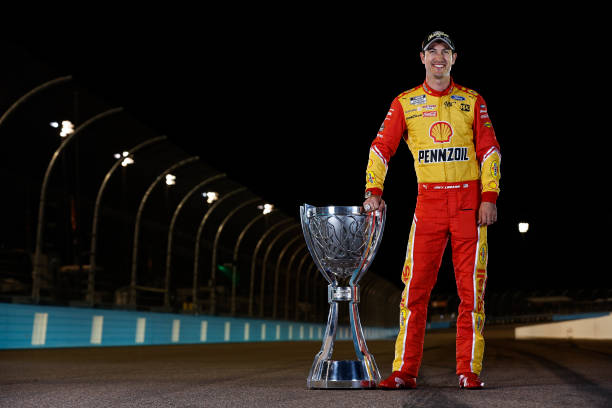 Joey Logano with Cup Series Championship trophy