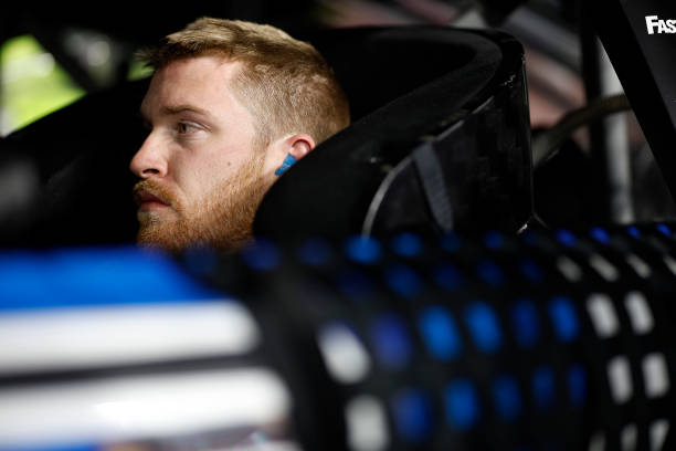 Chris Buescher sits in his car.