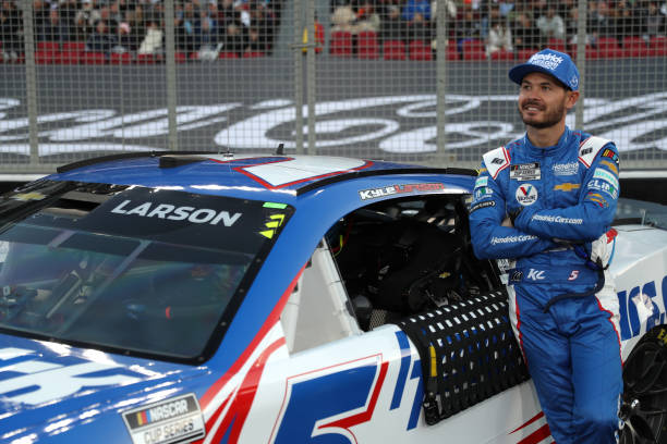 Kyle Larson leans on his car prior to The Clash.