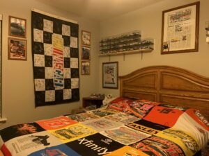 A black and white checkered NASCAR flag with driver autographs