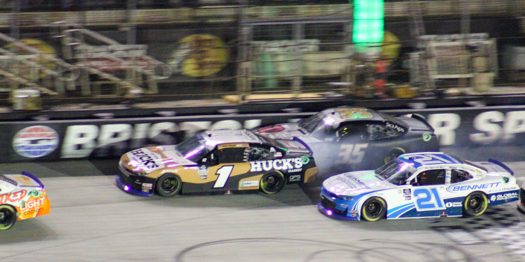 Sam Mayer running into the side of B.J. McLeod at the Bristol Night Race as Austin Hill goes to the inside