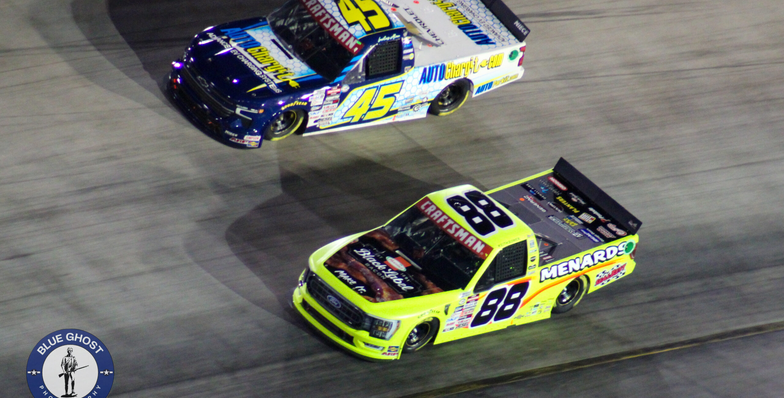 Matt Crafton passing under Lawless Alan during the 2023 Bristol Truck Night Race
