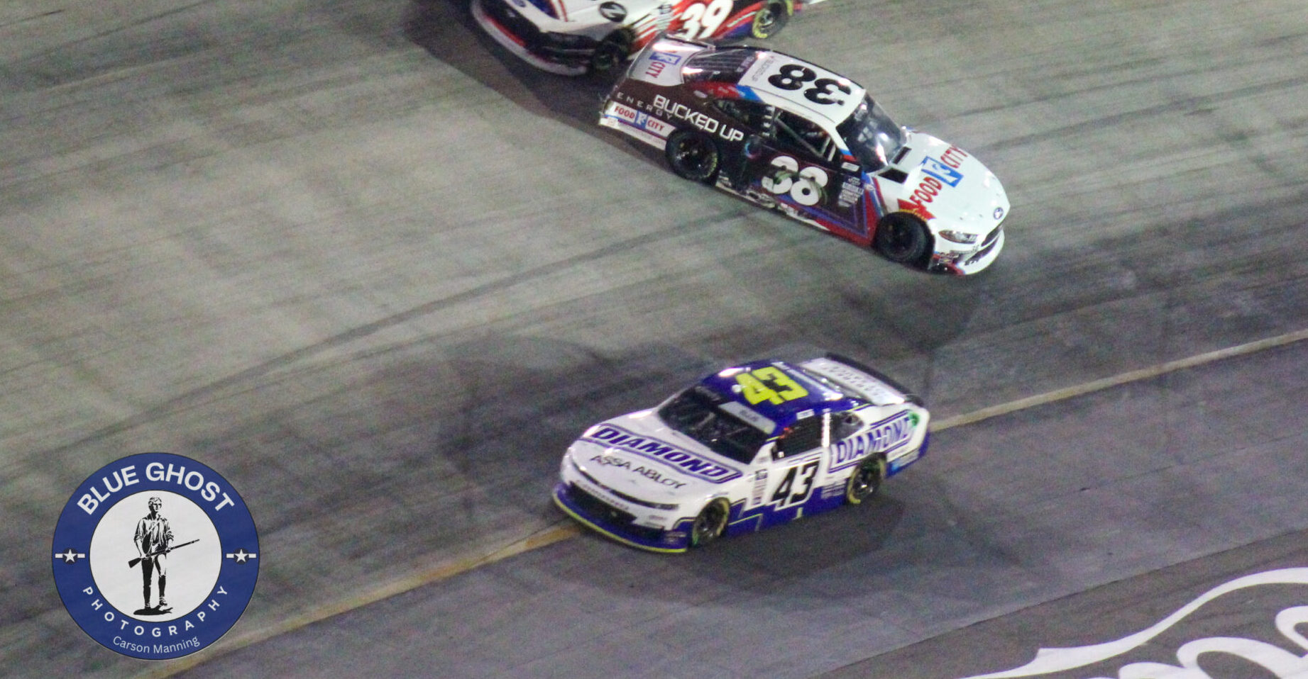 Ryan Ellis drives by a spinning Joe Graf Jr. during the 2023 Xfinity Bristol Night Race