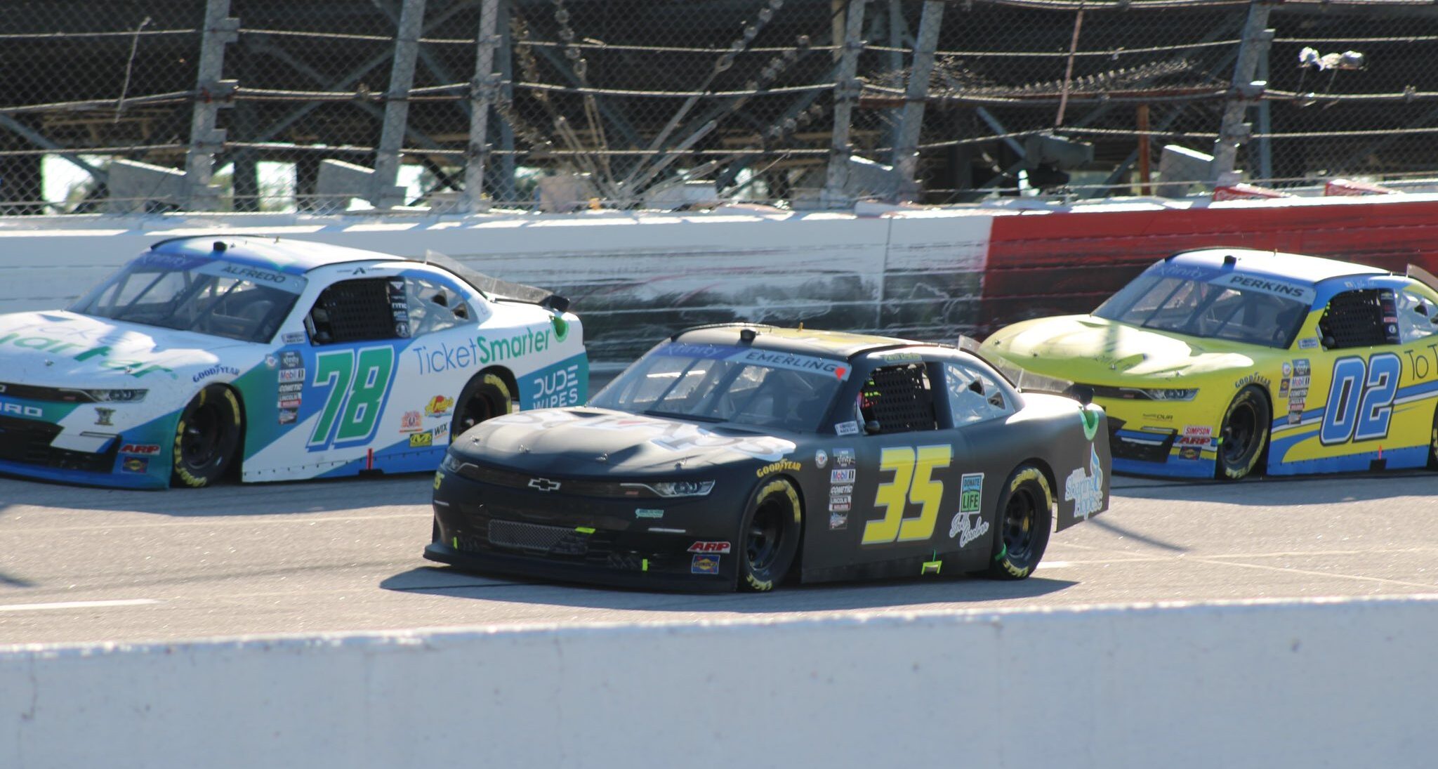 Patrick Emerling under Anthony Alfredo, trailed by Blain Perkins during the 2023 Fall Xfinity Darlington race