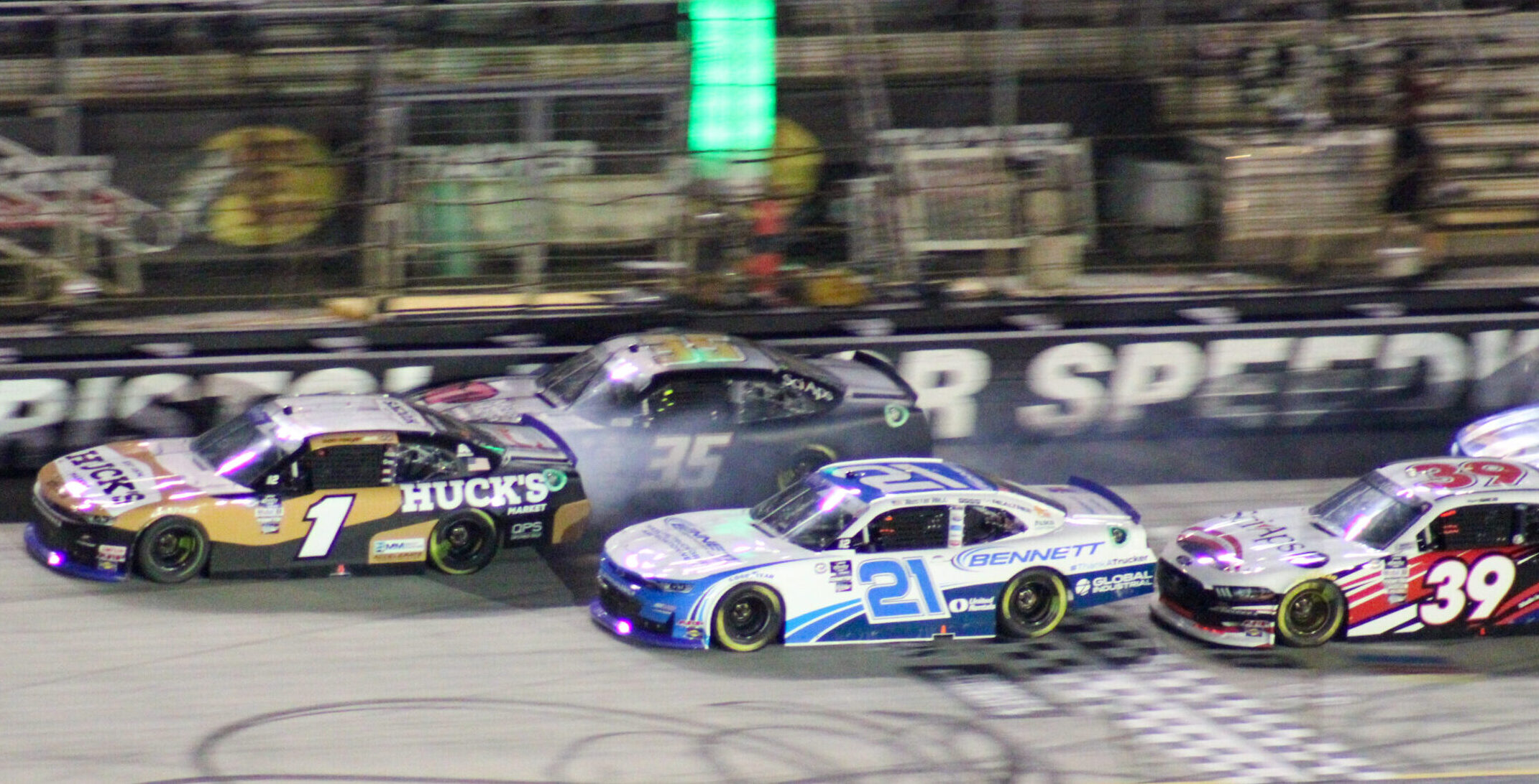 Sam Mayer runs the 35 car into the wall while Austin Hill battles along side during the 2023 Bristol Xfinity Night Race