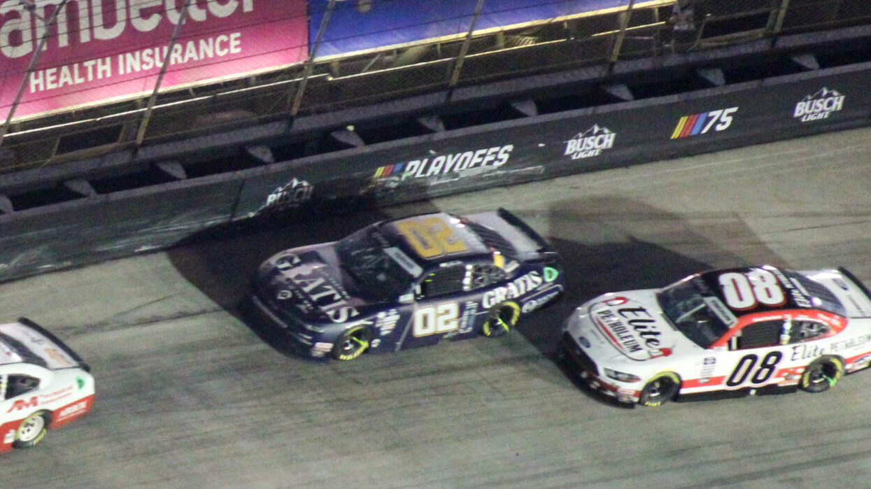 Blaine Perkins followed by Chad Finchum up high at the 2023 Bristol Night Race avoiding a wreck
