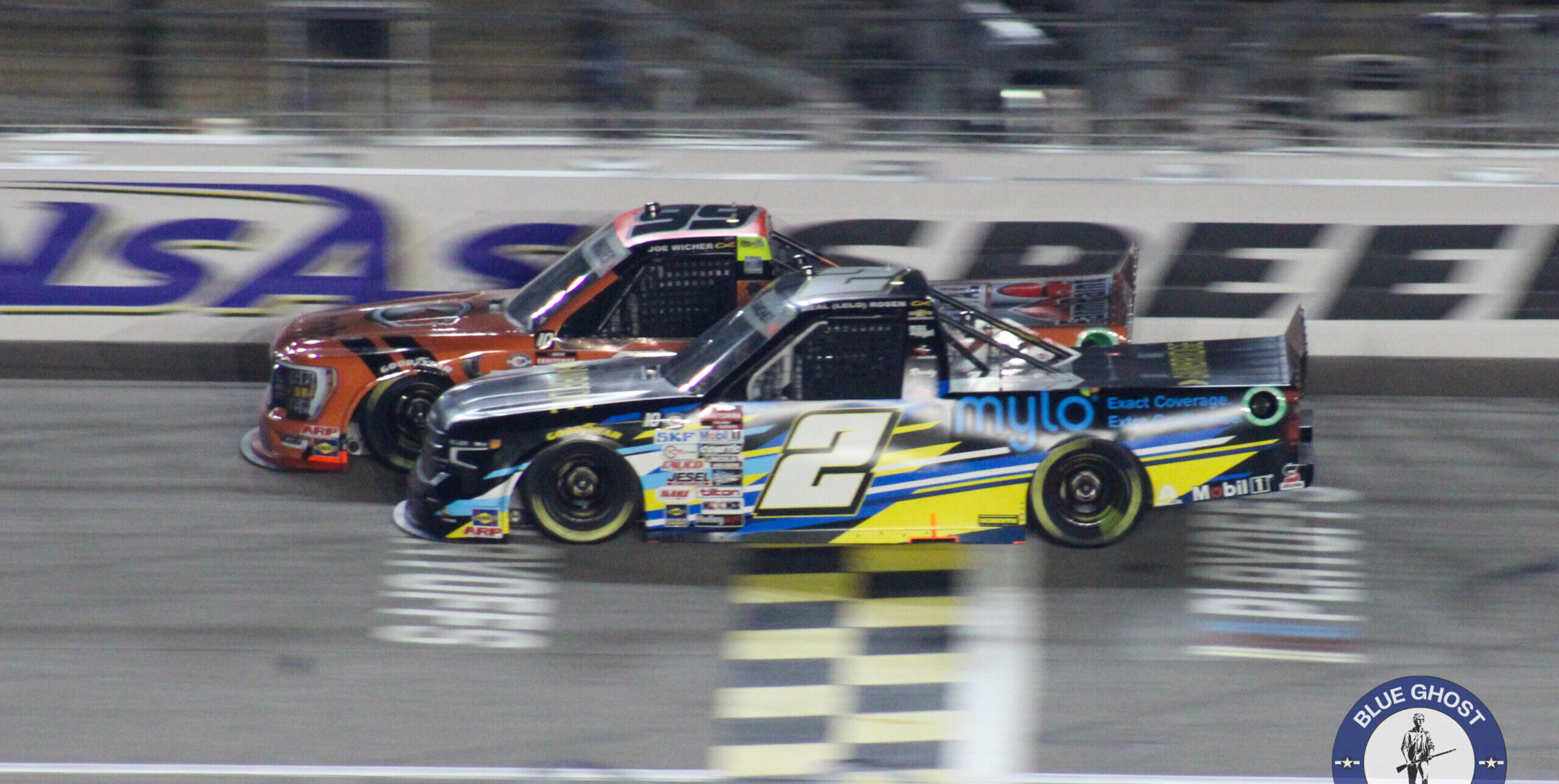 Nick Sanchez battles Ben Rhodes as they cross the start/finish line during the 2023 Fall Kansas Truck race