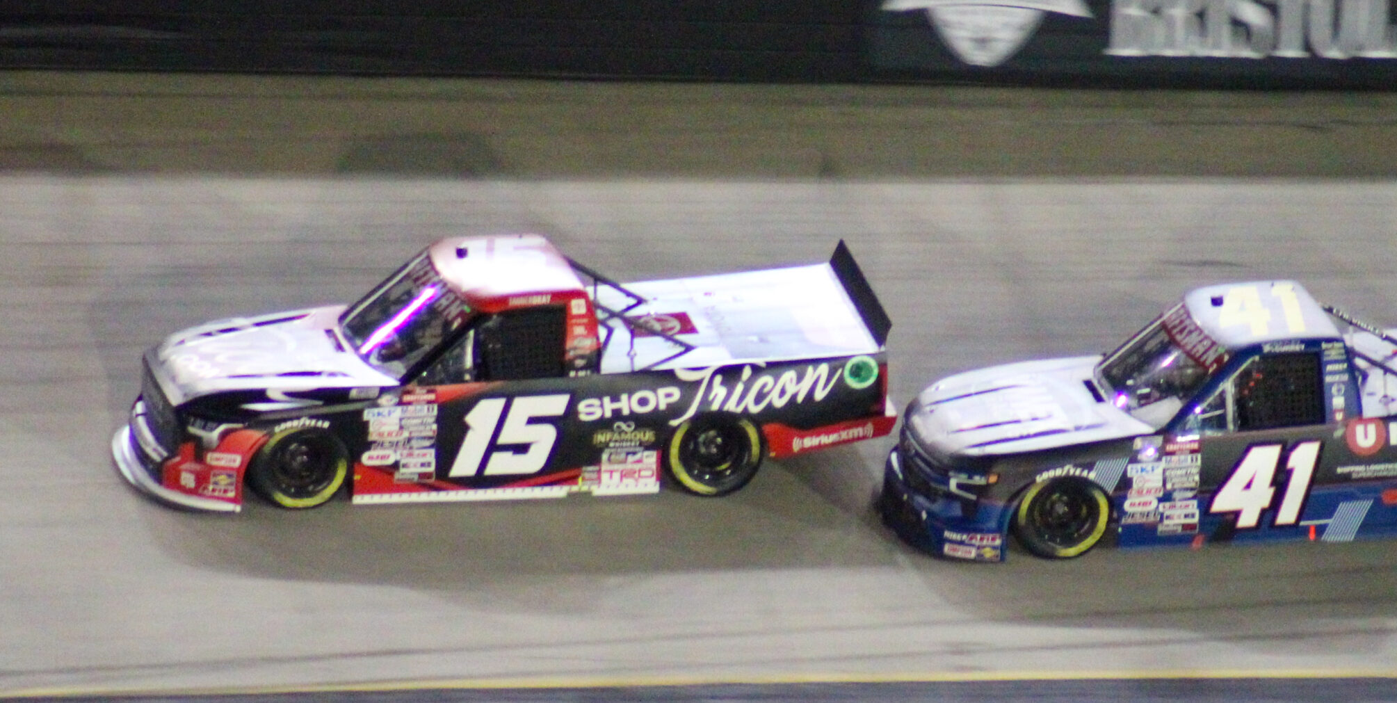 Tanner Gray battling Bayley Currey during the 2023 Bristol Night Truck Race