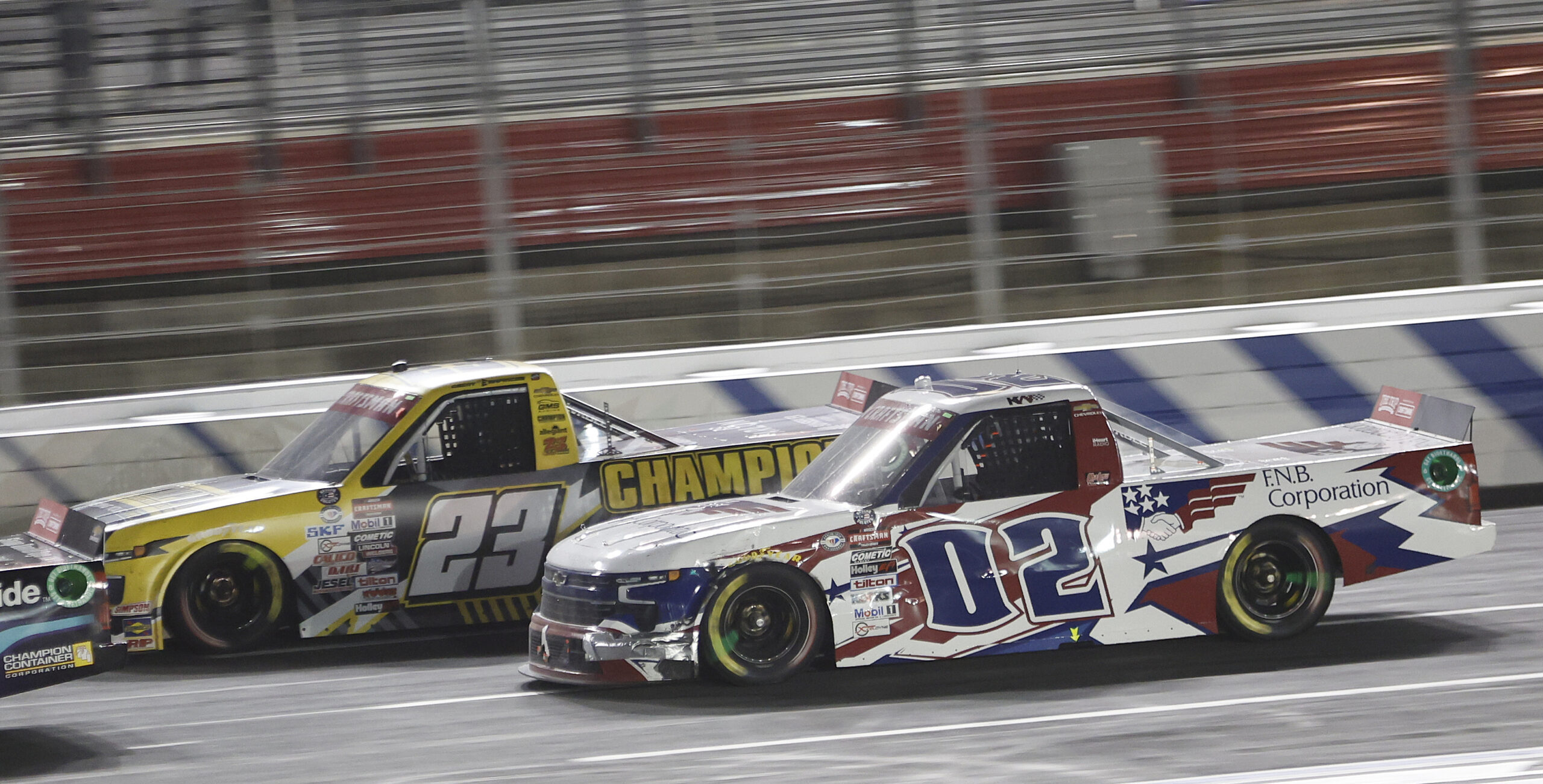 Kris Wright racing Grant Enfinger during the 2023 Truck race at Charlotte Motor Speedway